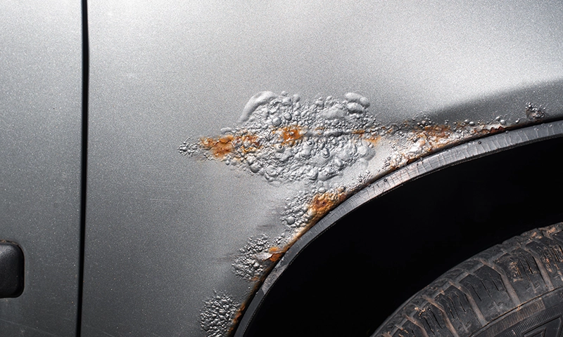 Rust forming under paint above a tire well